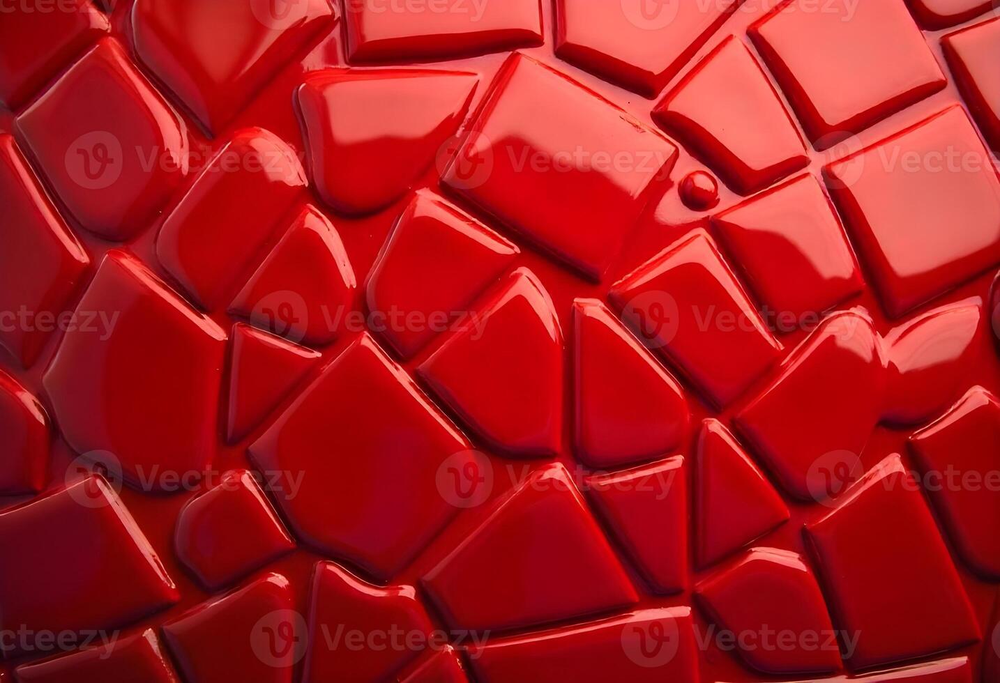 Close-up of glossy red mosaic with irregular tiles and reflective textured surface photo