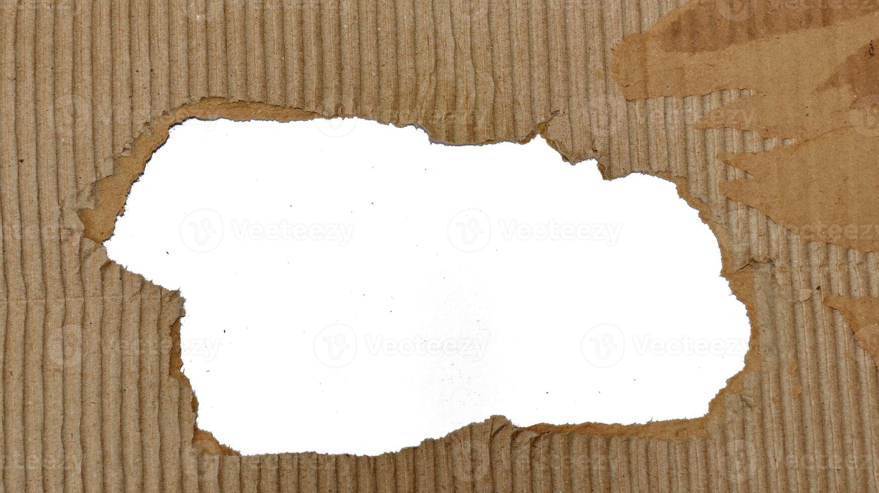 Brown paper box texture or cardboard with torn photo