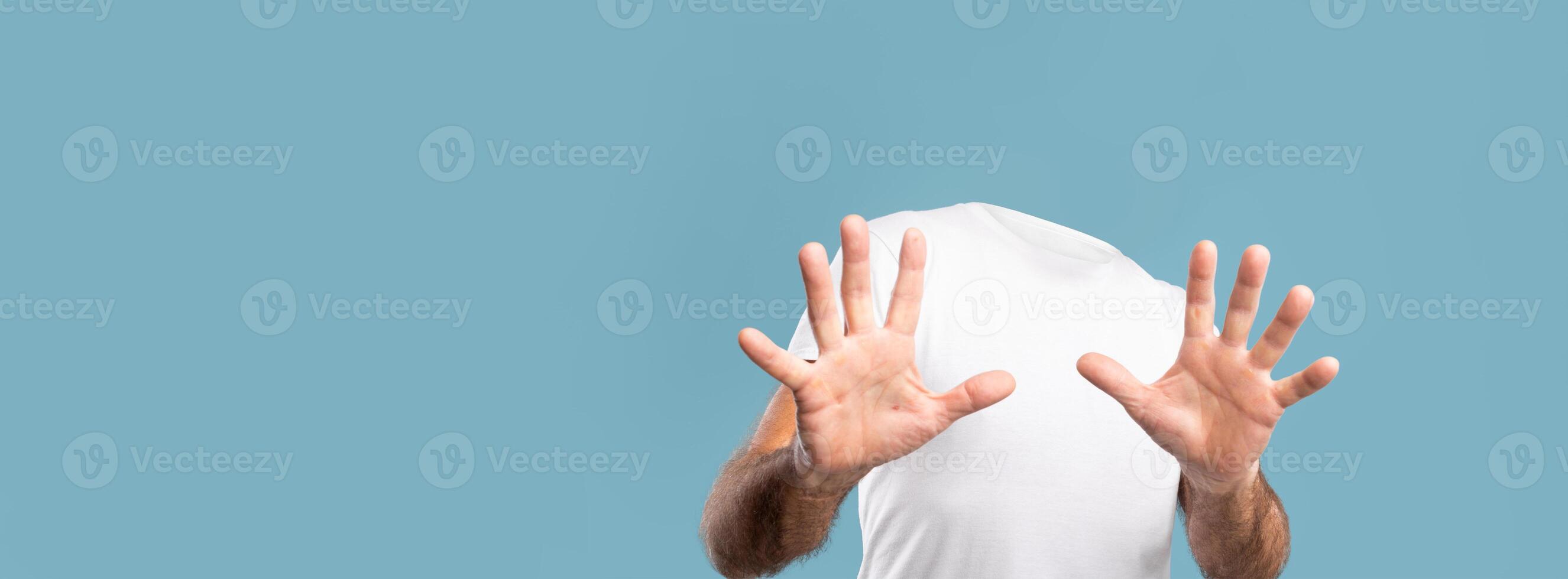 A unique depiction of headless figure, highlighting a sense of isolation. The minimalist background emphasizes the lifestyle theme, creating an intriguing visual element. photo
