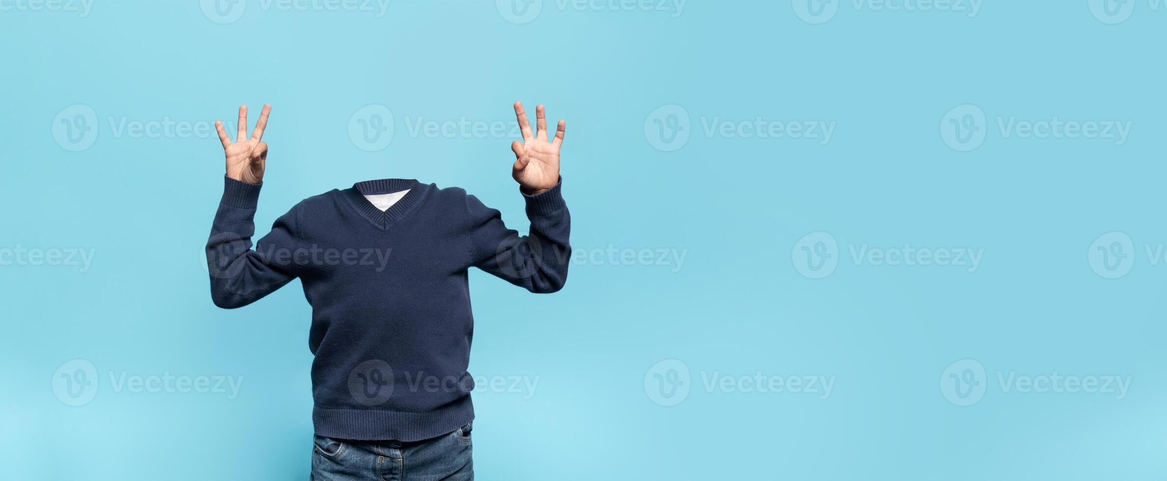 In a stylish backdrop, individual without heads showcase a playful and carefree lifestyle. His body language conveys excitement while enjoying a serene, isolated environment. photo