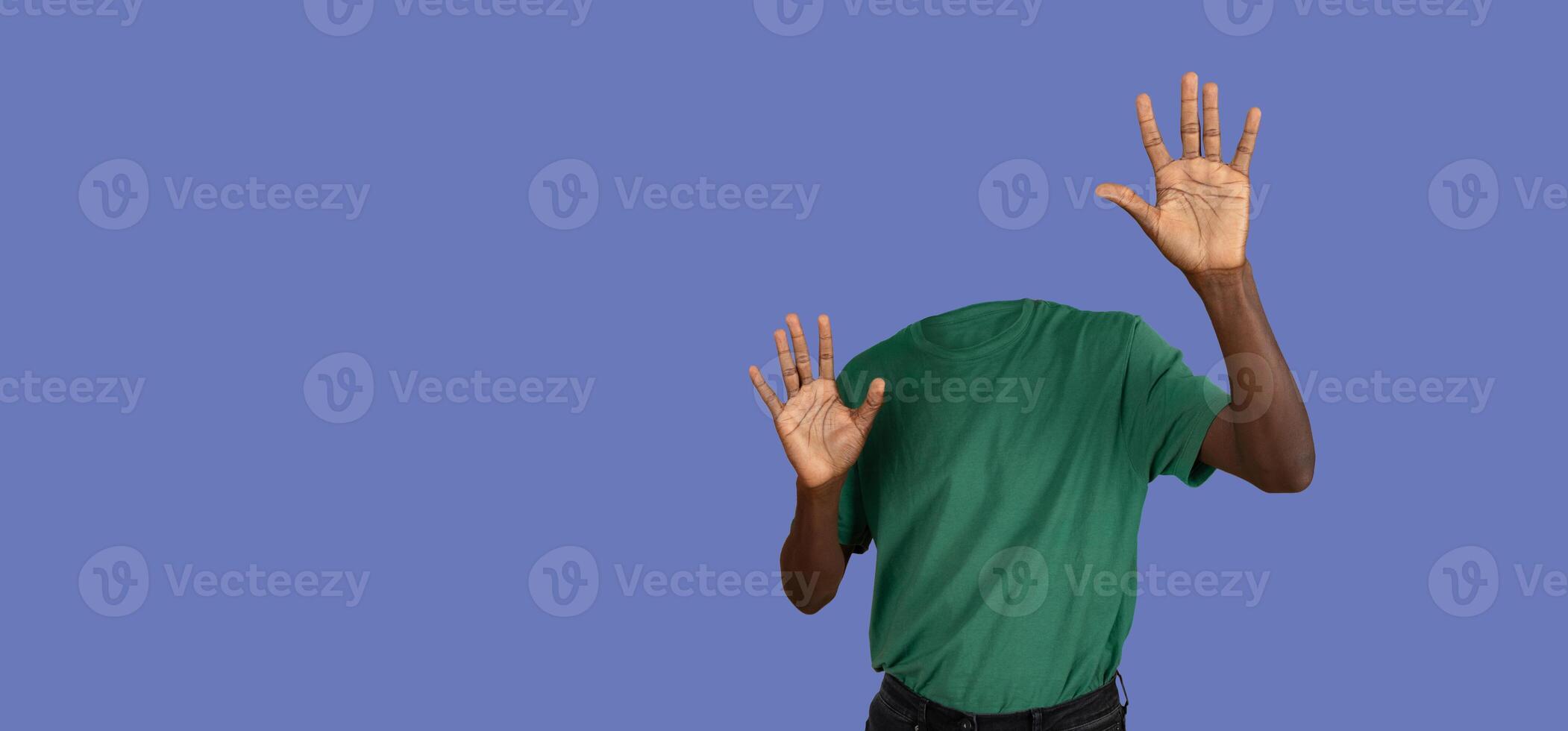 Headless person holding hands in front of him, purple background, panorama with copy space photo