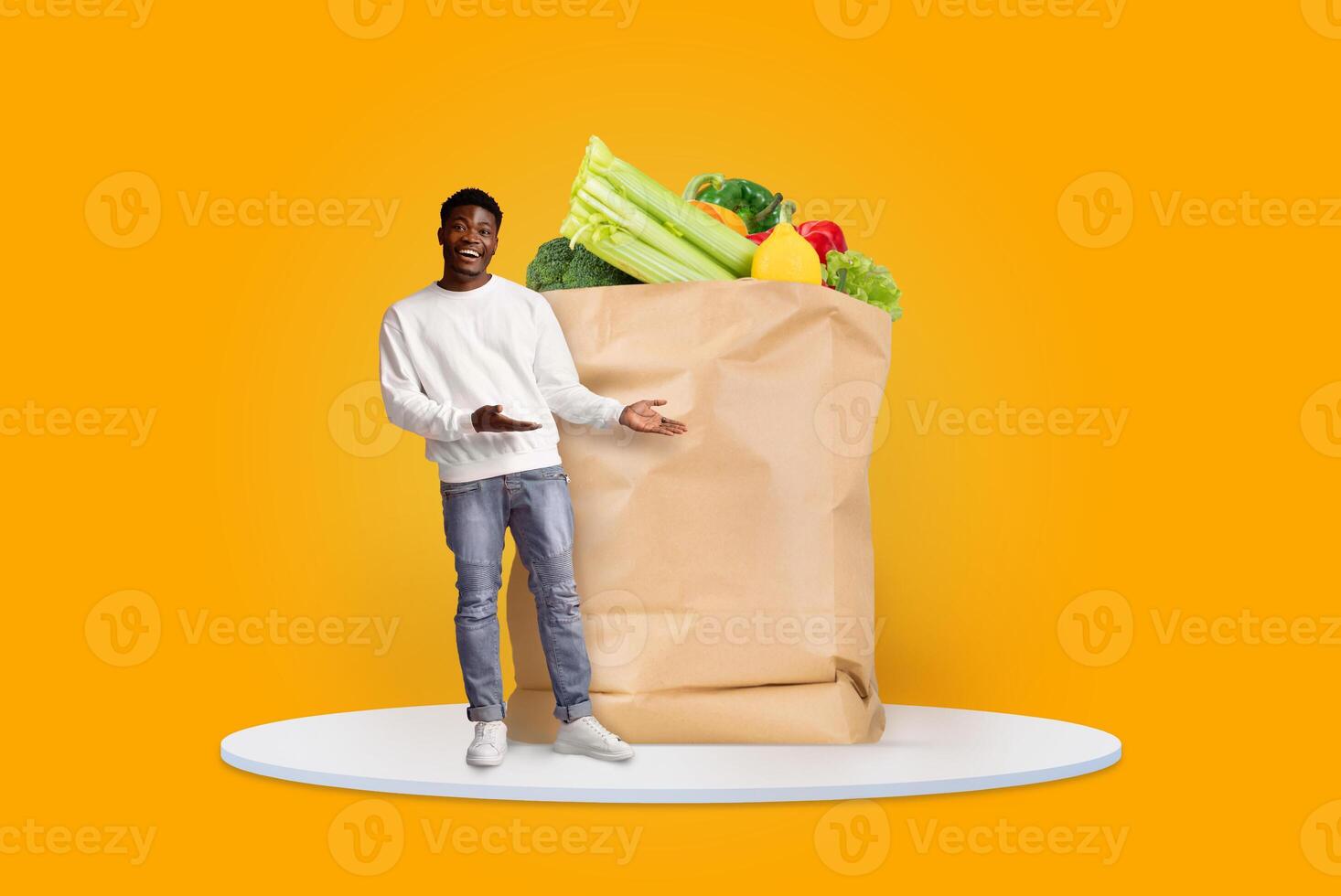 A customer stands with an open paper bag filled with fresh groceries, showcasing a variety of vegetables. The bright background emphasizes the modern shopping experience during changing times. photo