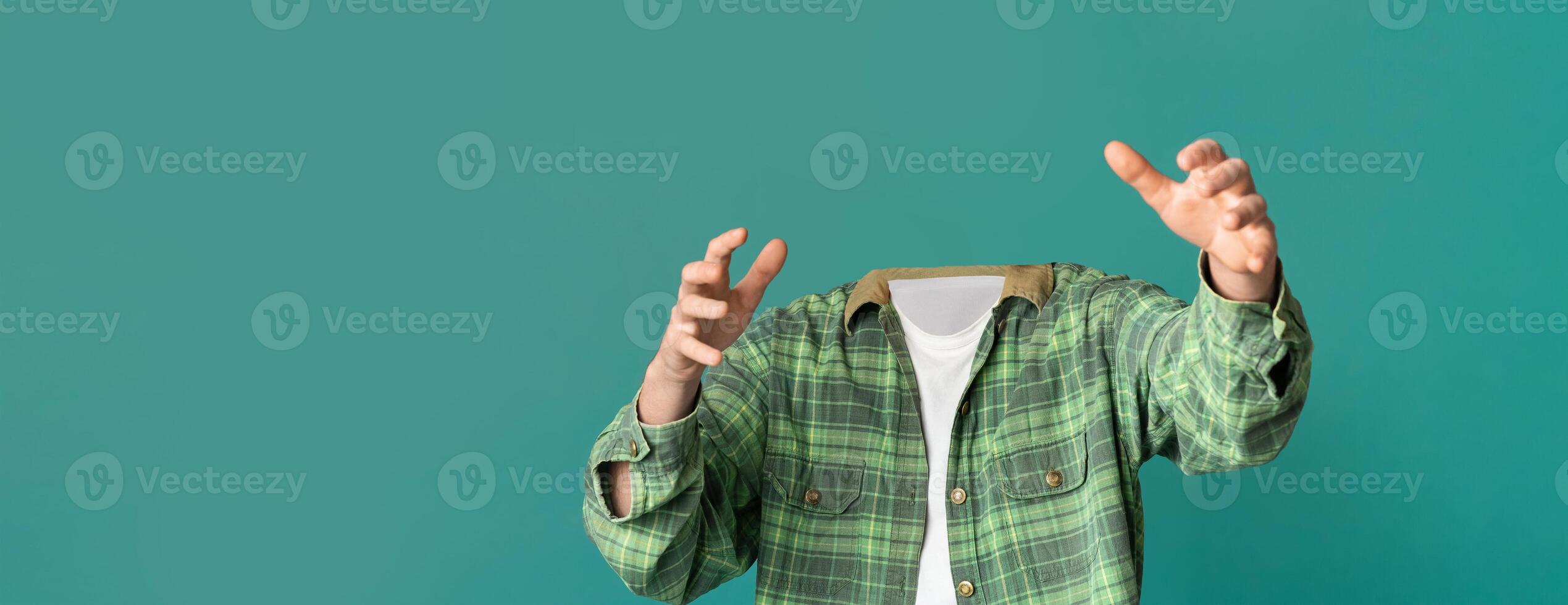 A unique visual showcases headless guy reaching out, set against a vibrant, plain background. This artistic representation creates an intriguing focus on gestures and movements. photo