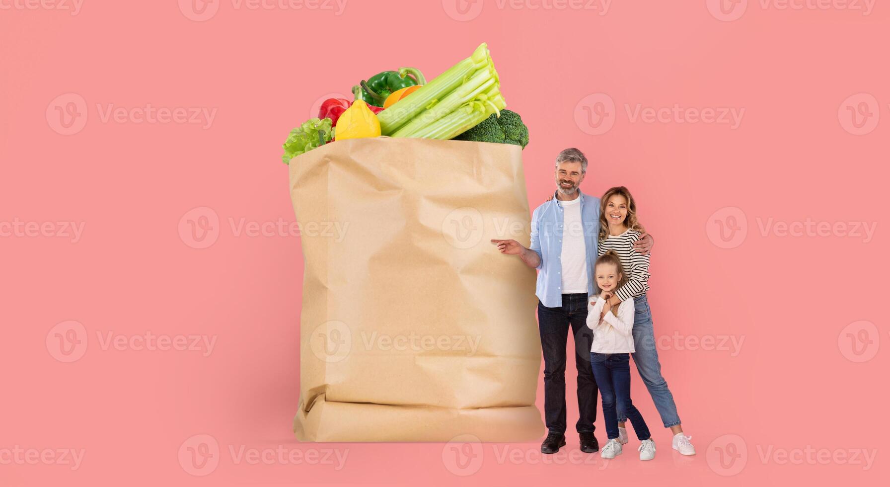 A family stands next to a large paper grocery bag filled with fresh produce. They appear joyful and engaged in a shopping experience that reflects modern lifestyle changes. photo
