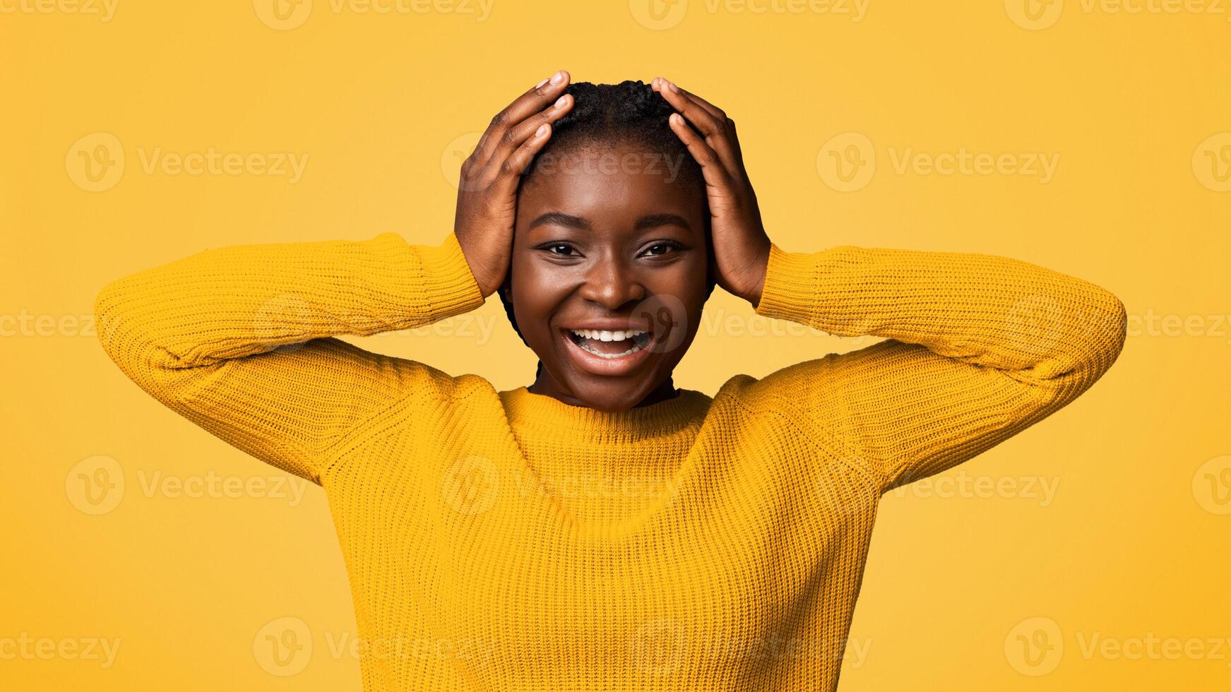 Unbeliavable. Happy Young Black Woman Touching Head In Excitement, Emotionally Reacting To Good News, Cheerful African American Lady Looking At Camera, Posing Over Purple Studio Background, Free Space photo