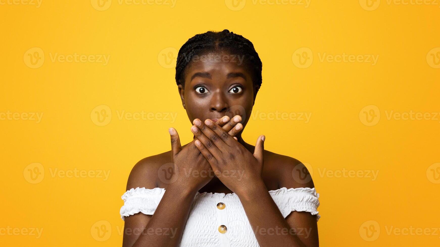 No Way. Shocked African American Woman Covering Face With Crossed Palms, Looking At Camera With Astonishment, Standing Speachless Over Yellow Background, Emotionally Reacting To News, Copy Space photo