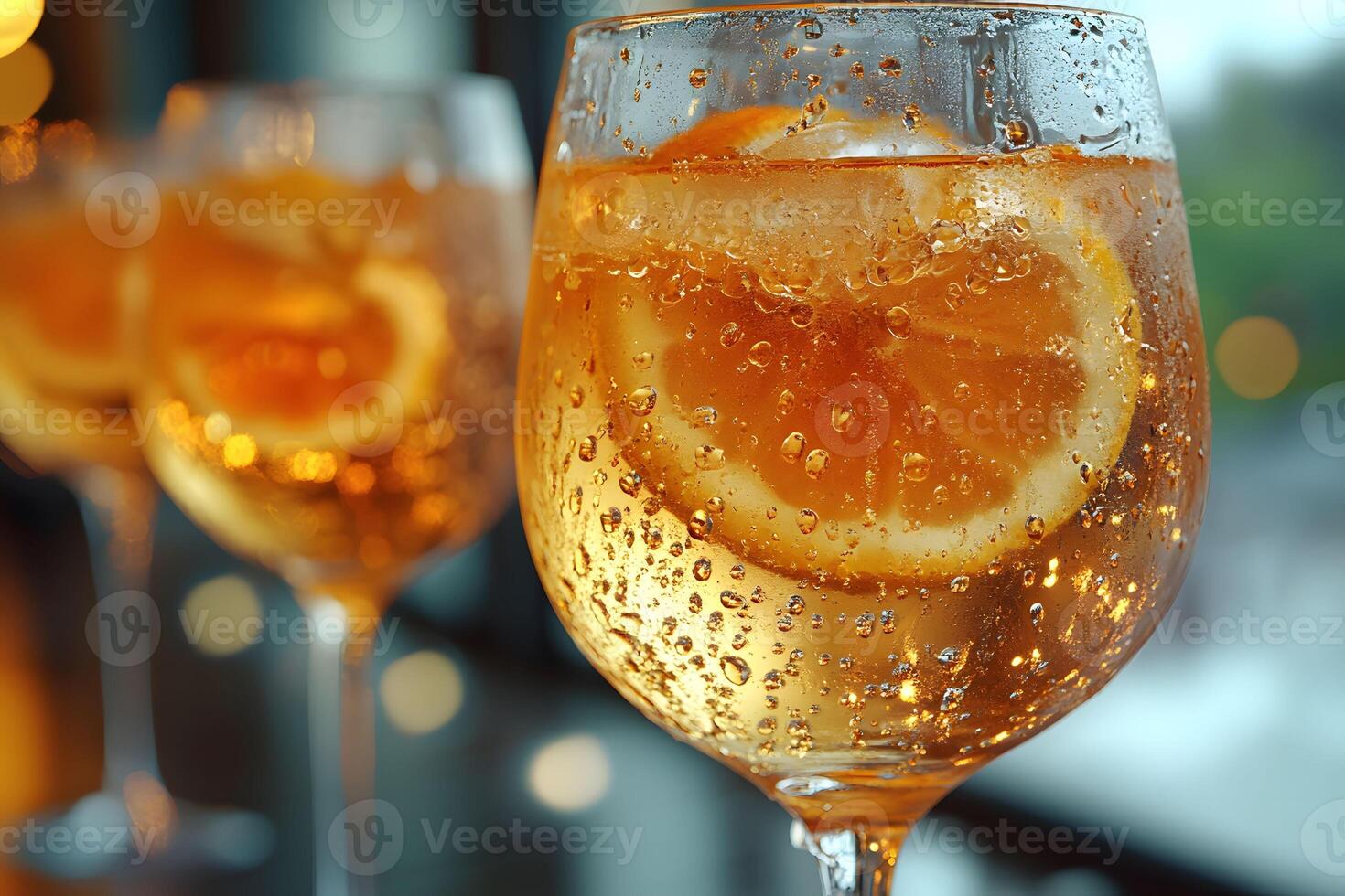 Refreshing Summer Cocktail with Orange Slices in Elegant Glasses photo