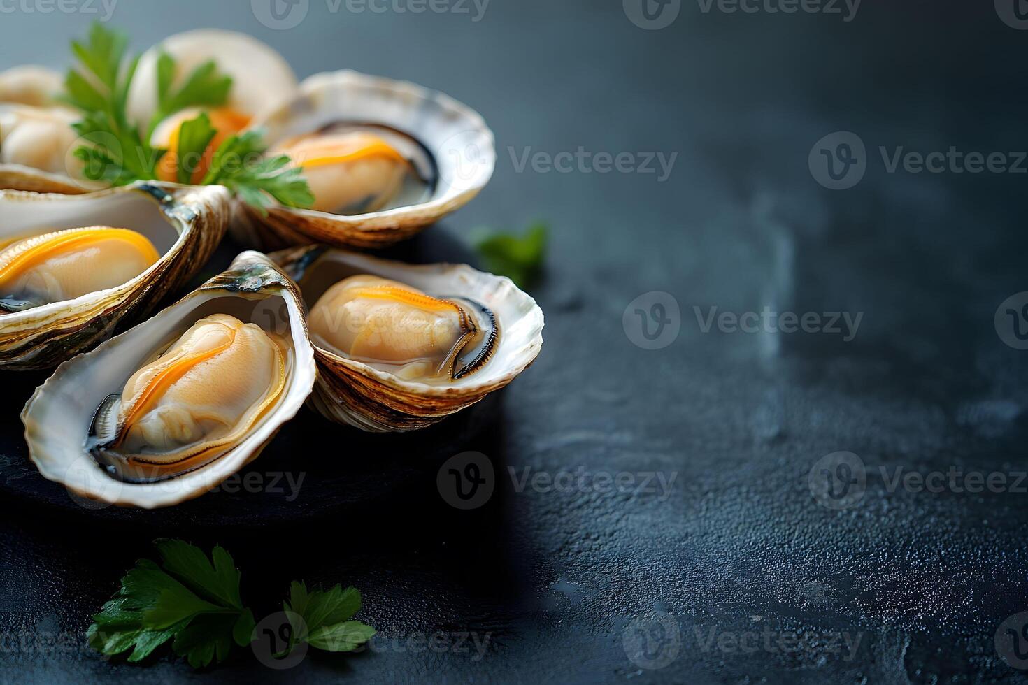 Fresh Oysters on Dark Slate Background for Culinary and Dining Concepts photo