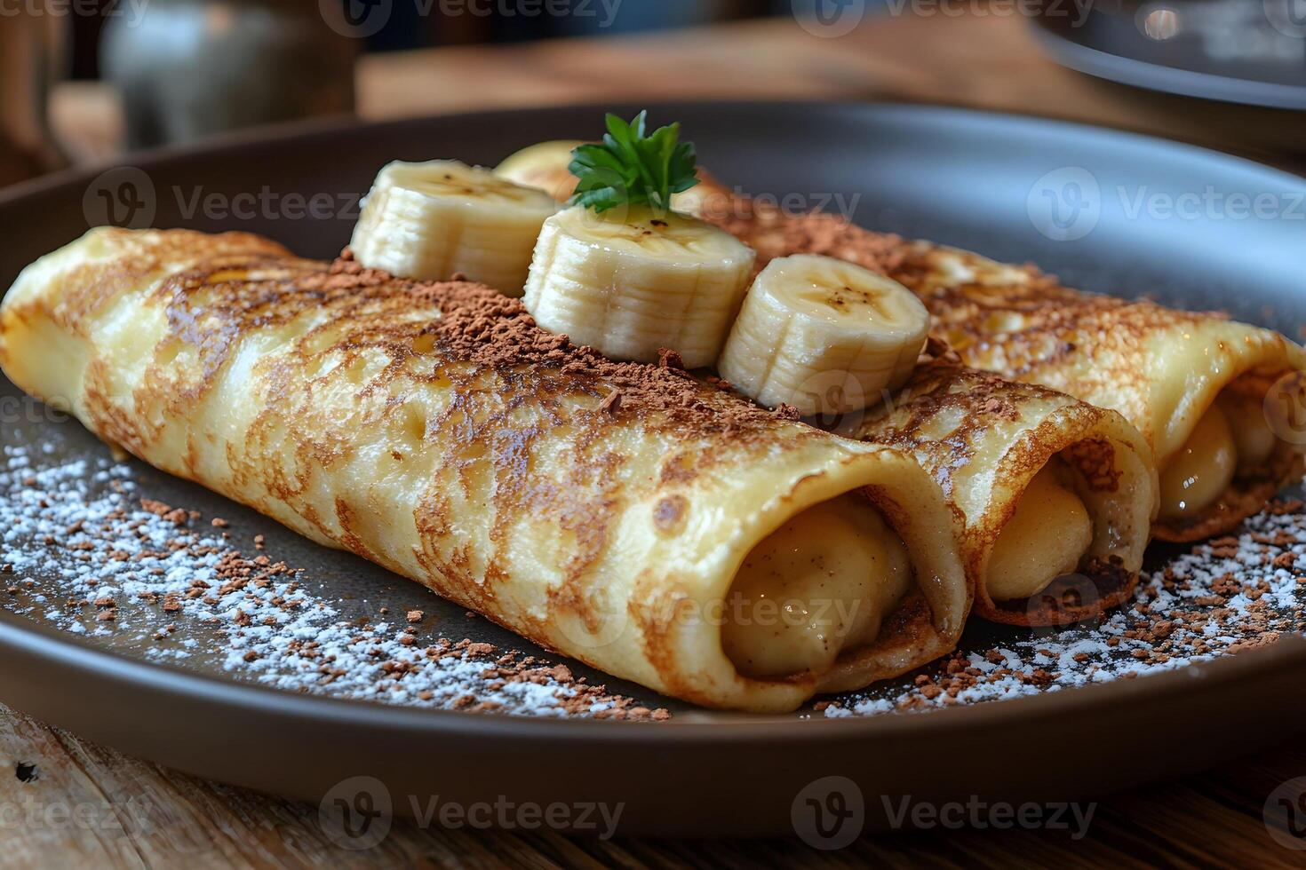 Delicious Banana Pancake Rolls with Cocoa and Powdered Sugar - Perfect for Breakfast or Dessert photo
