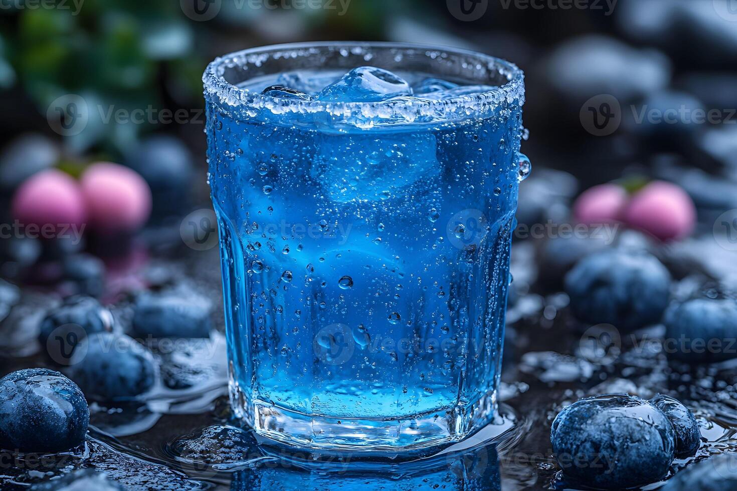 Refreshing Blueberry Cocktail with Ice and Berries in Nature-Themed Setting photo