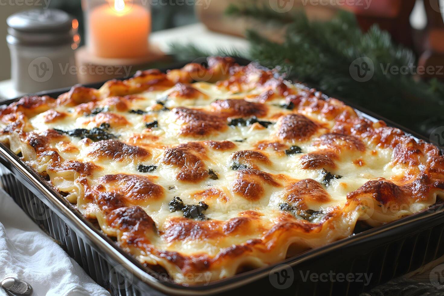 Baked Cheese Spinach Lasagna in Black Tray for Festive Holiday Dinner photo