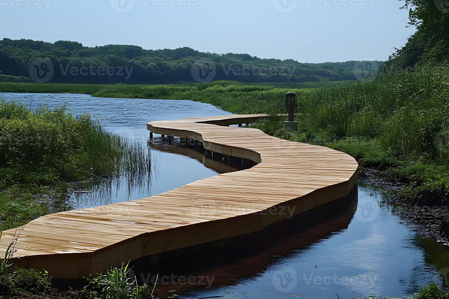 Serene Wooden Walkway Through Lush River Landscape for Nature Relaxation photo