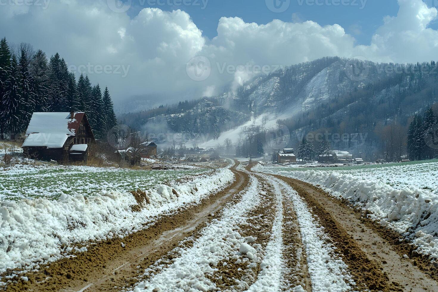 Serene Snowy Mountain Landscape with Path Leading to Rustic Cabins photo