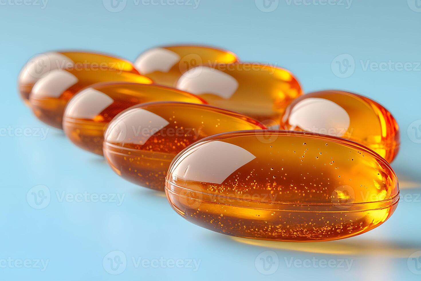 Close-up of Shiny Omega-3 Capsules on Blue Background for Health and Wellness Concepts photo