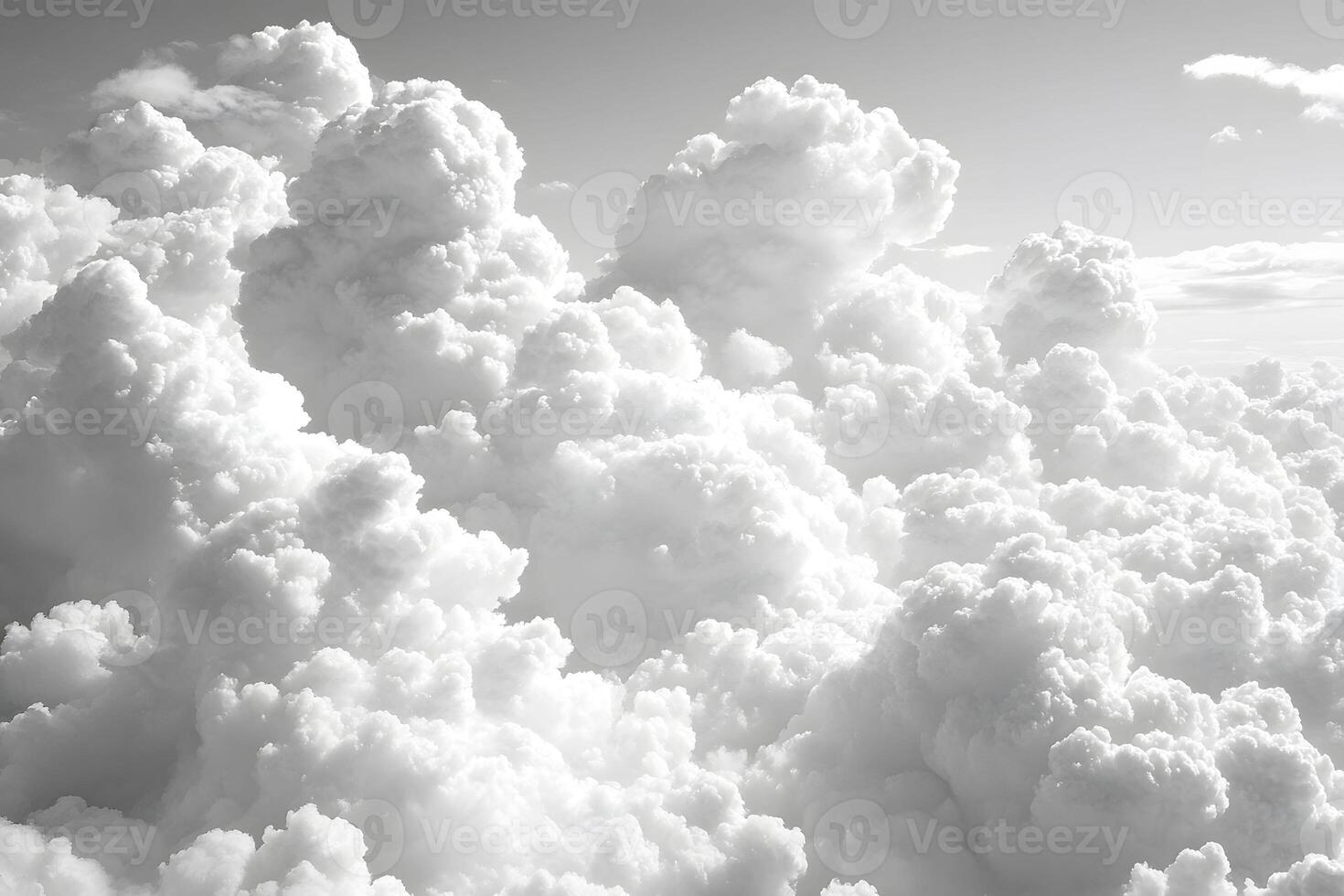 Dramatic Cloudscape with Fluffy White Clouds in a Clear Sky, Ideal for Nature and Weather-Themed Prints photo