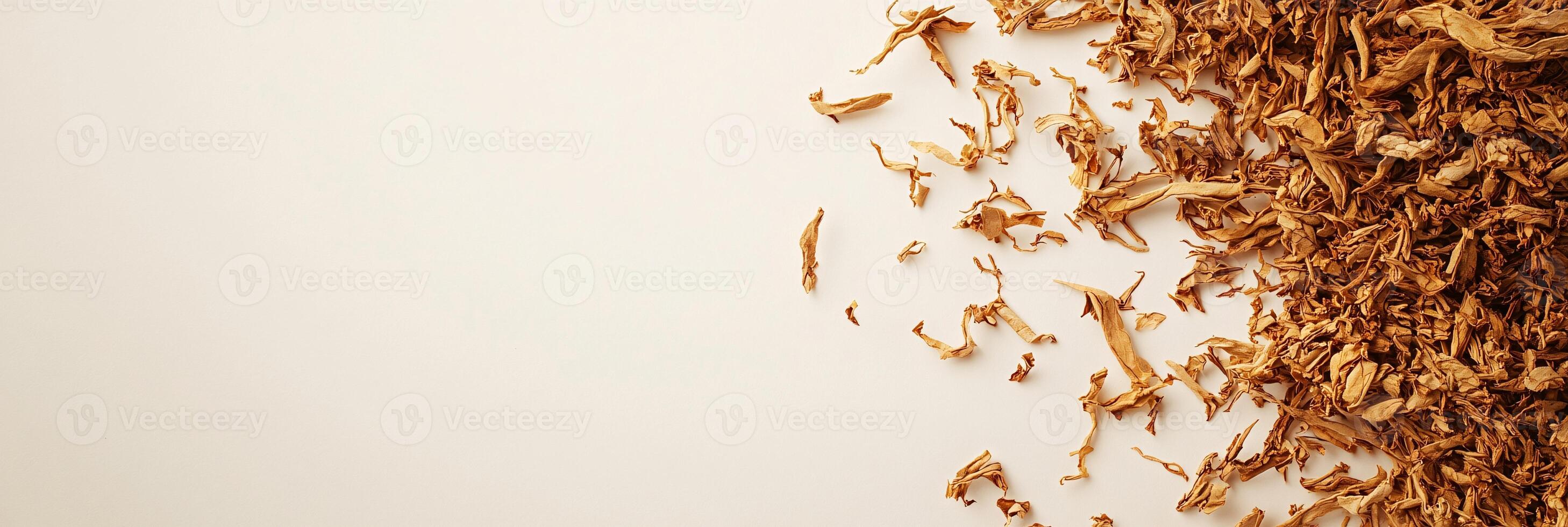 Shredded Tobacco in Upper Corners Against Soft Neutral Background photo