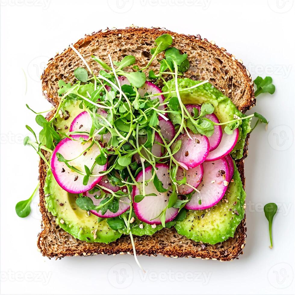 Avocado Toast Sandwich on Rustic Whole Grain Bread with Microgreens and Radishes photo