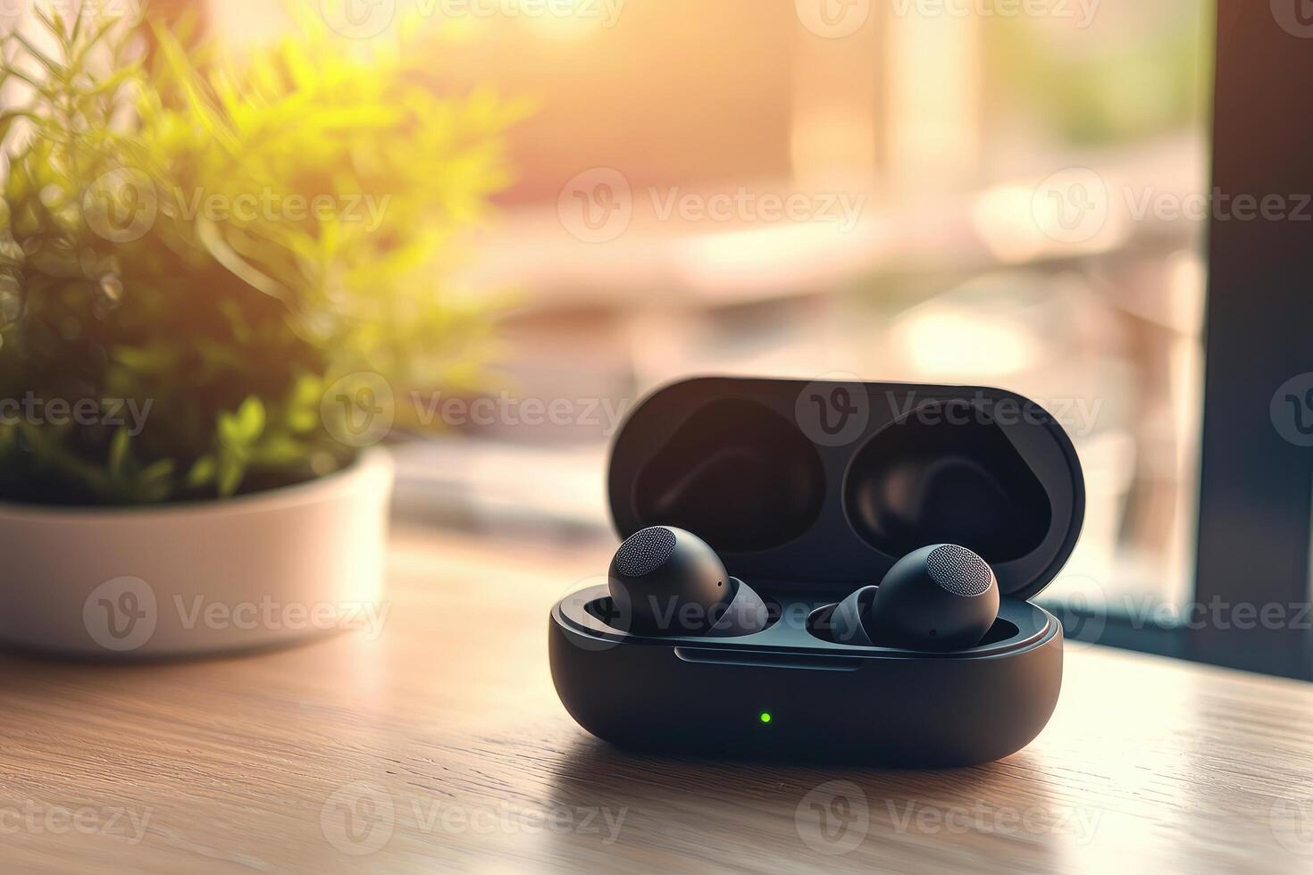 Black true wireless earbuds charging in open case on wooden table photo