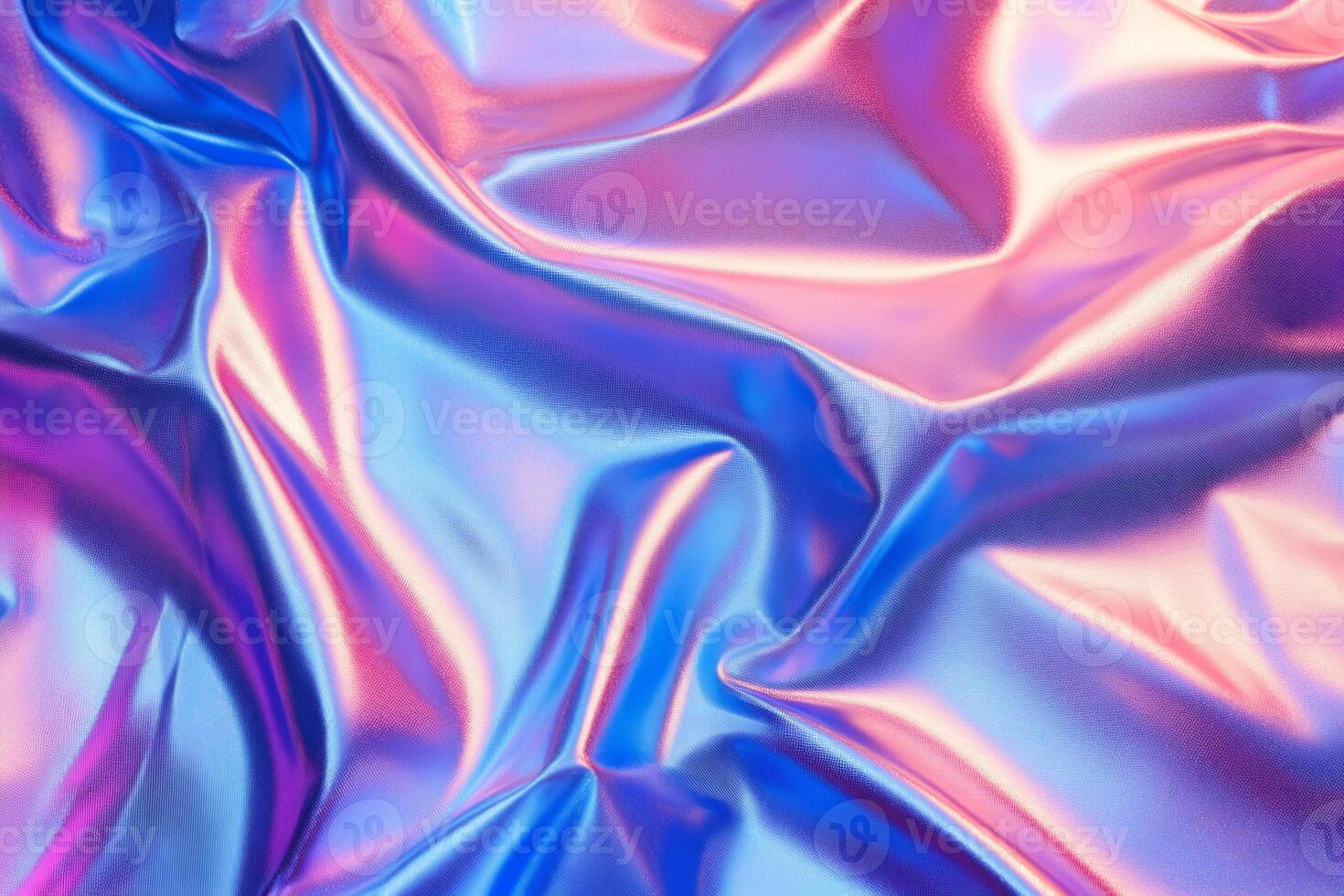 Holographic iridescent wrinkled foil fabric creating abstract waves photo