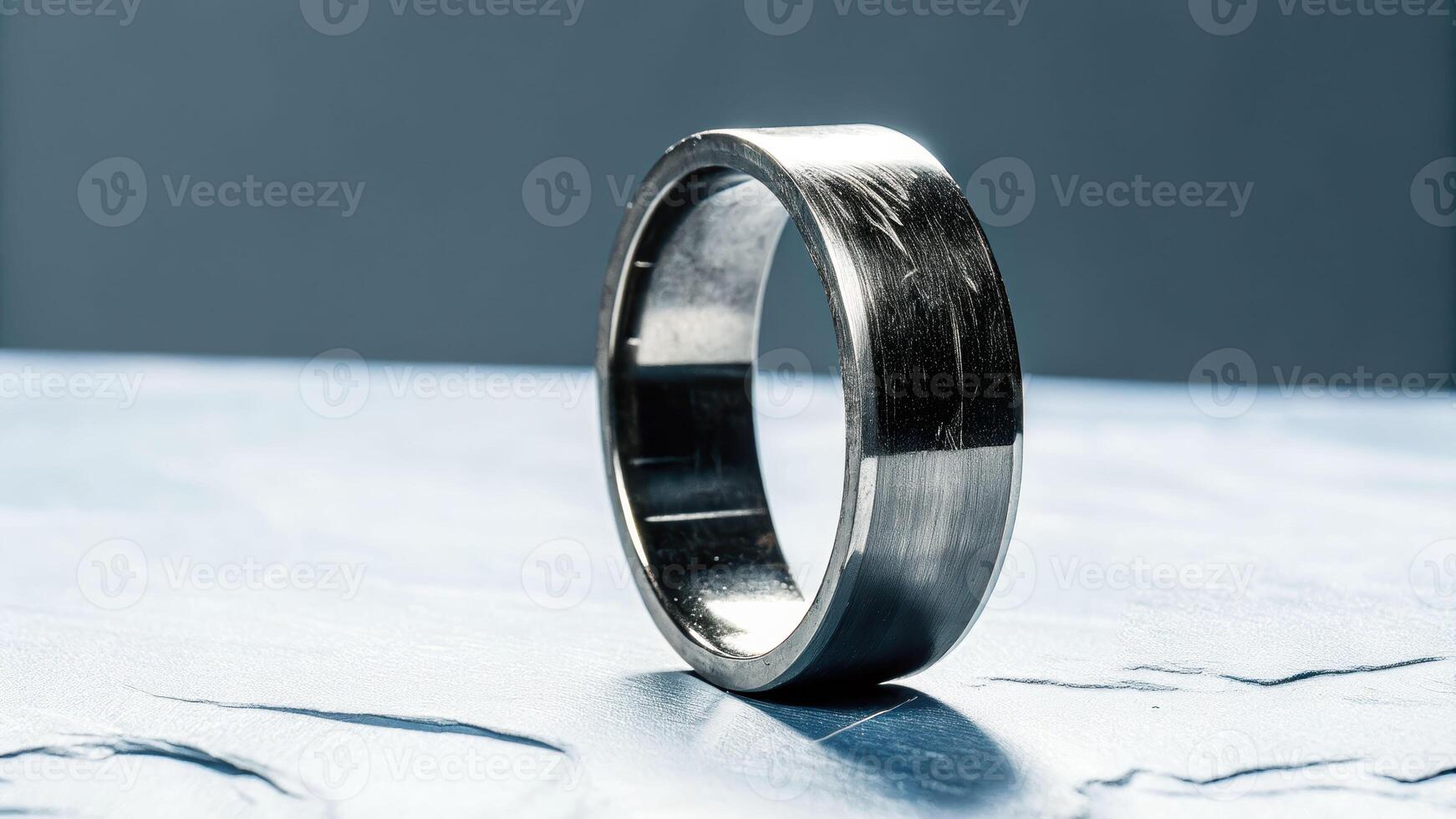 Macro shot of a titanium ring showing wear textured stone surface close-up detailed industrial concept photo