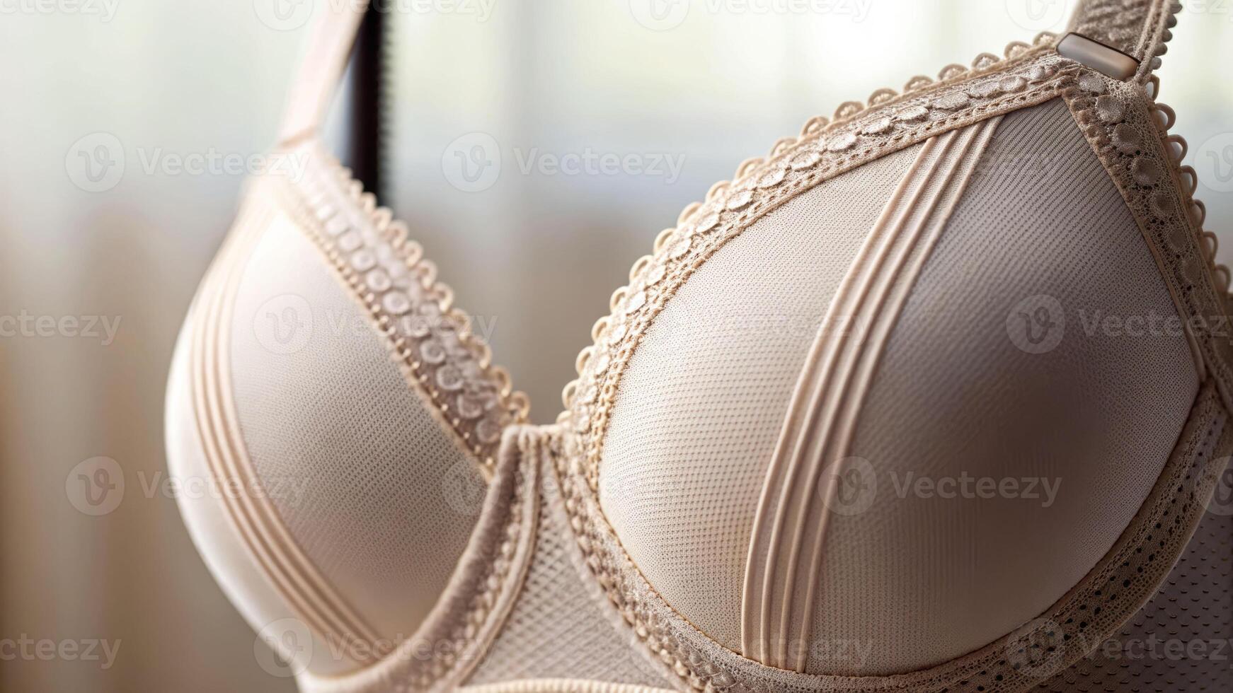 Closeup shot of brassiere fabric and stitching details soft focus lingerie photography elegant craftsmanship photo
