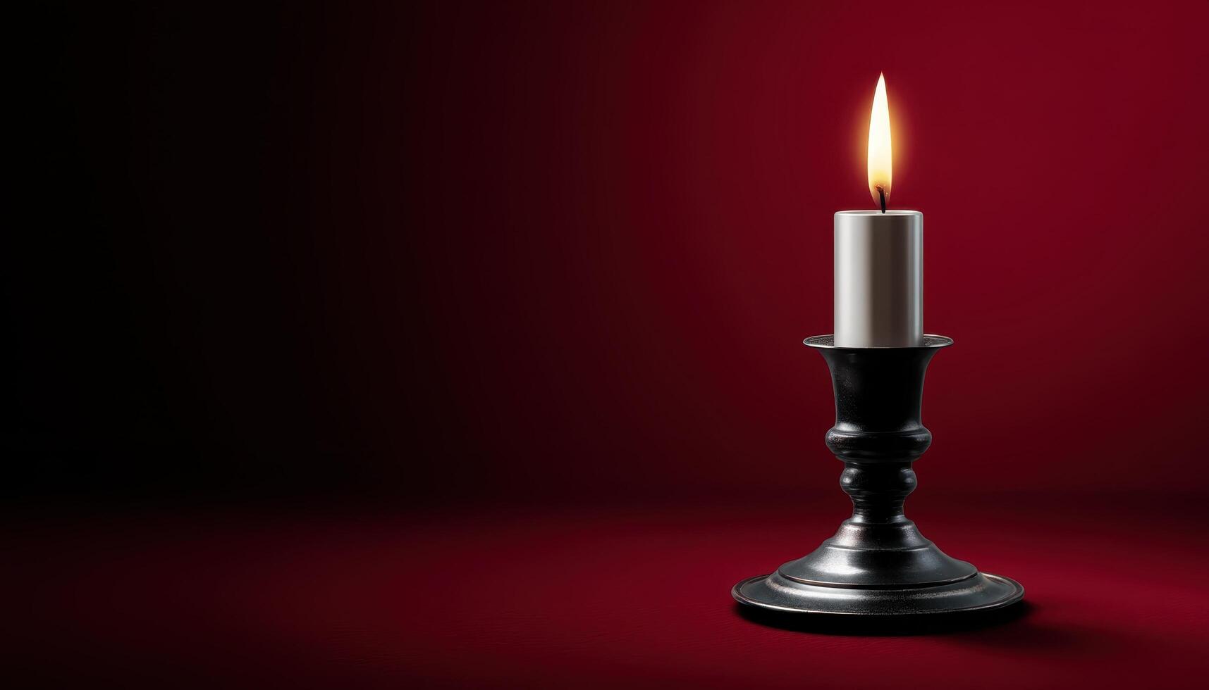 Illuminated candlestick against deep vivid background still life artistic setup warm lighting photo