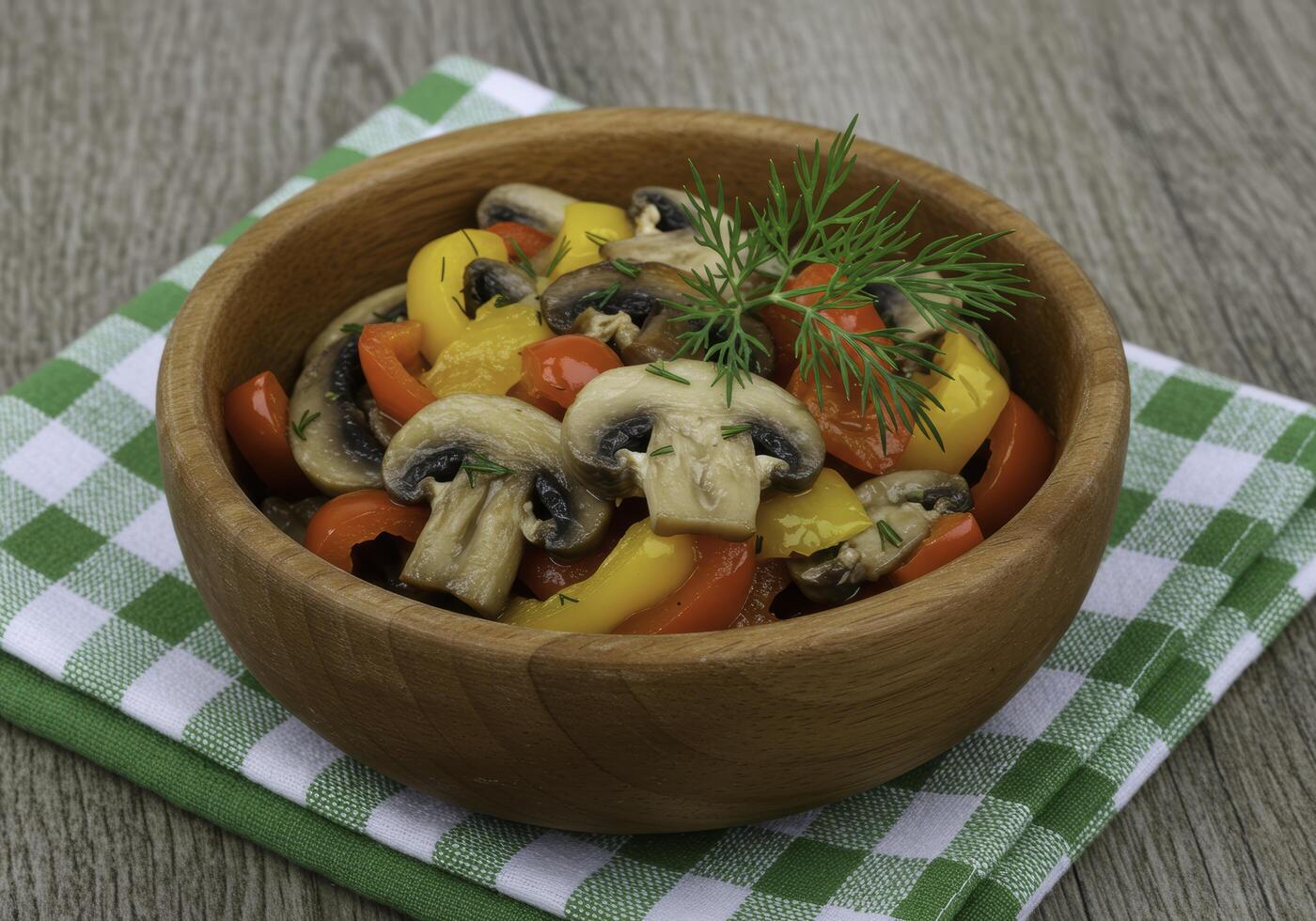 Rustic presentation of sauteed mushrooms and peppers in wooden bowl arrangement photo