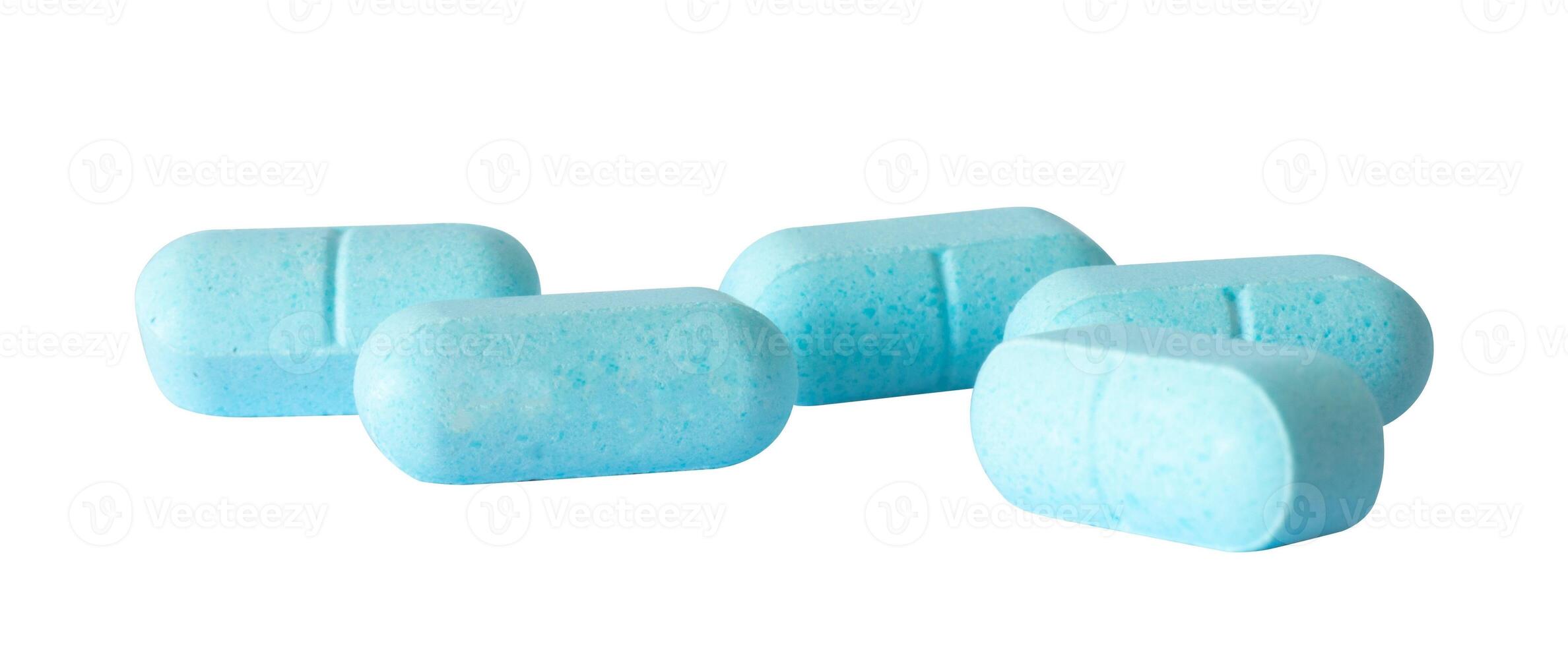 blue drug tablets on white surface photo