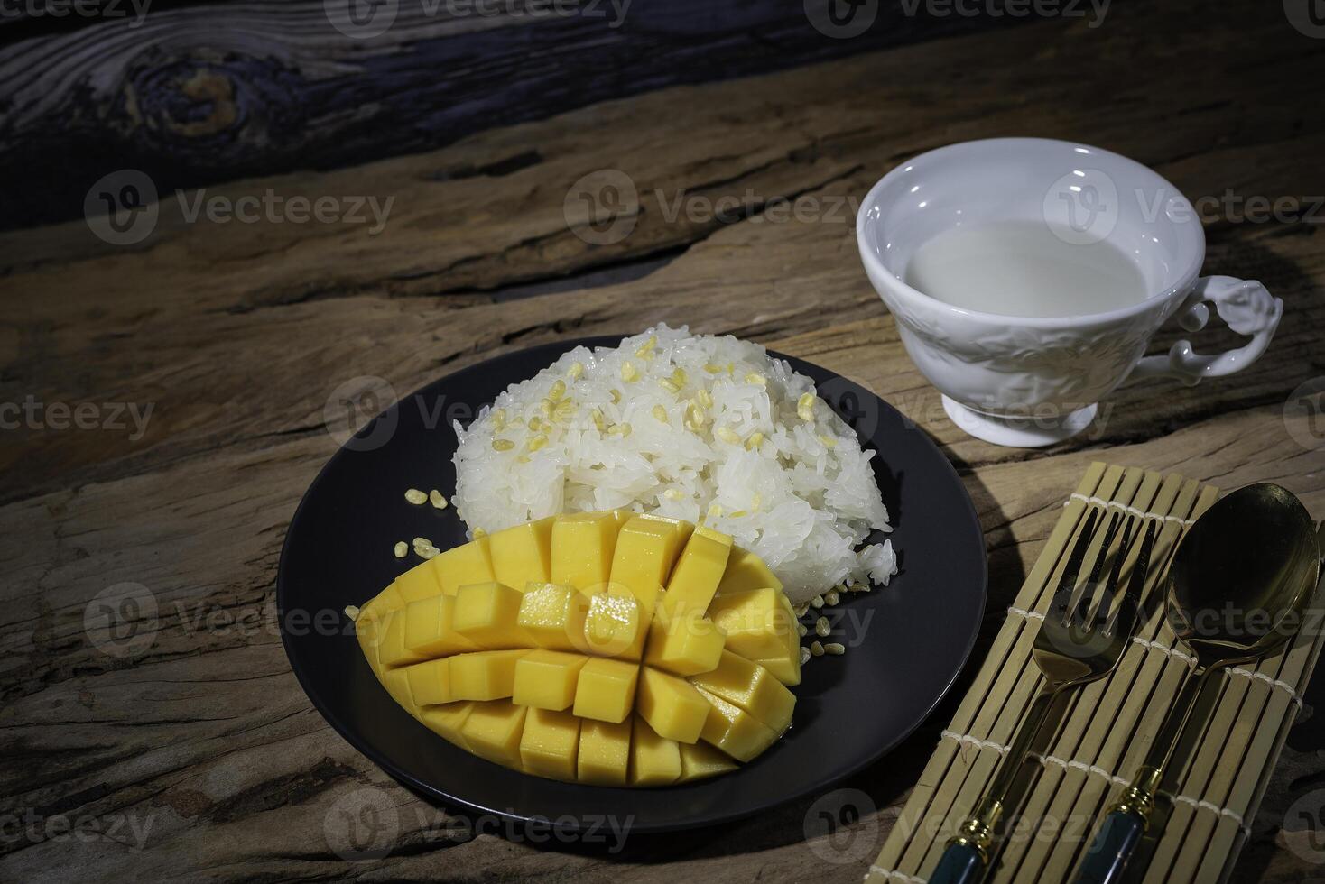 Street food, sticky rice with mango, Thai food, good taste, Asian food, very popular in Asia. photo