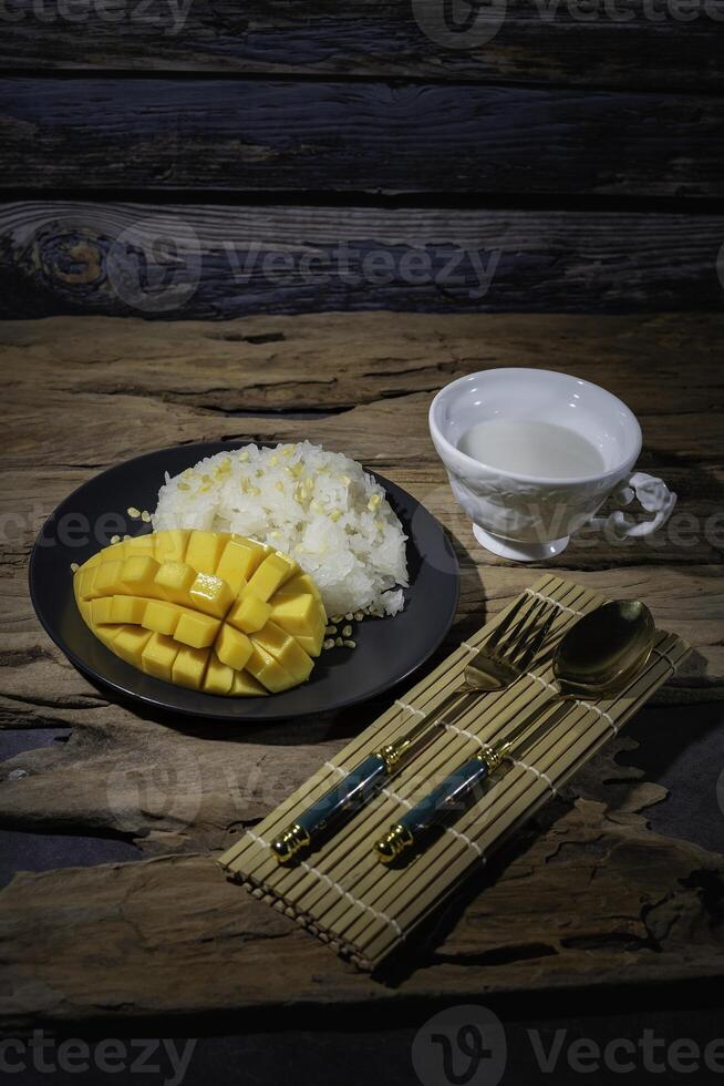 Thai food, street food, sticky rice and ripe mango, delicious and very popular among Thai people. photo