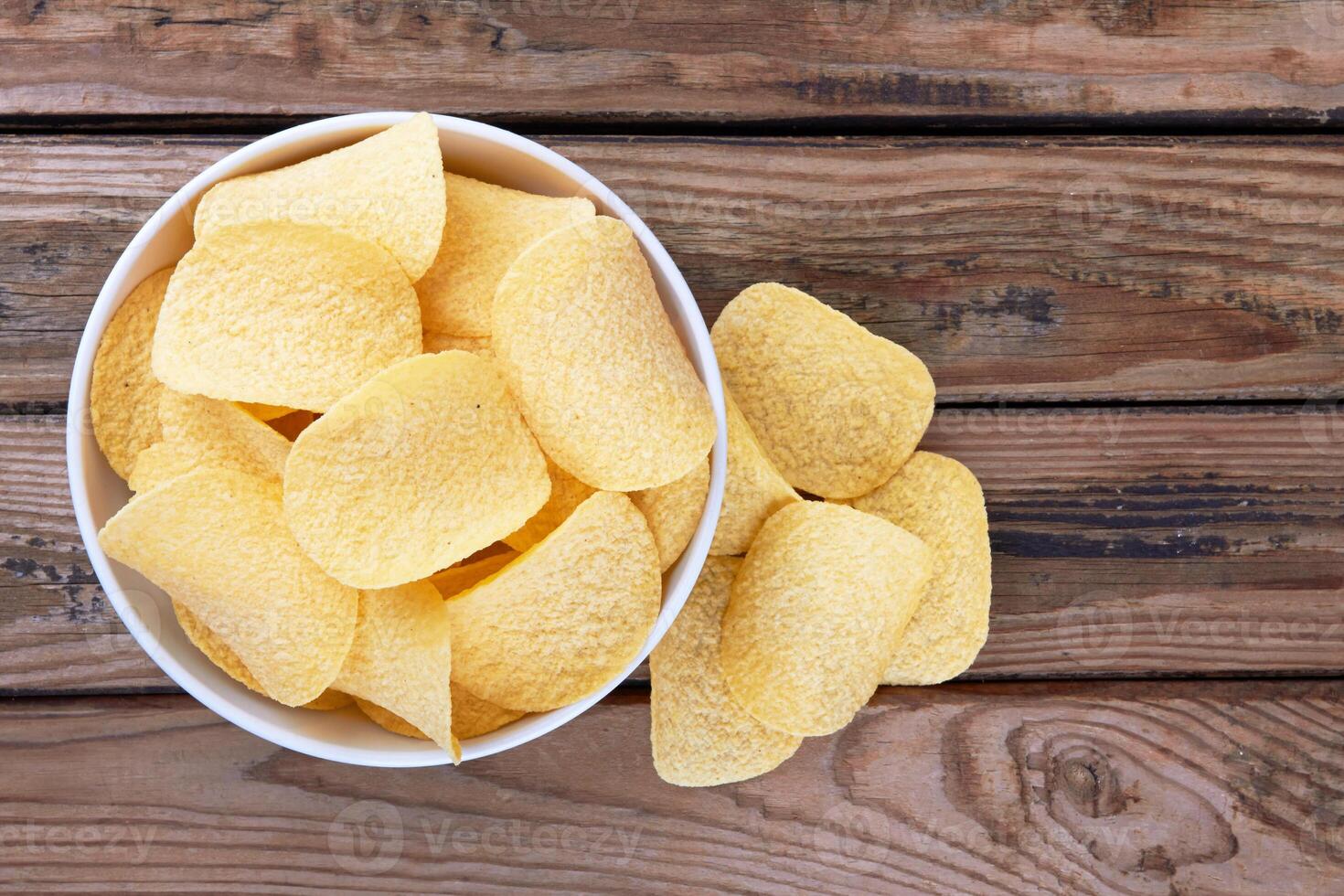 Potato chips in a saucer as a background for eat photo