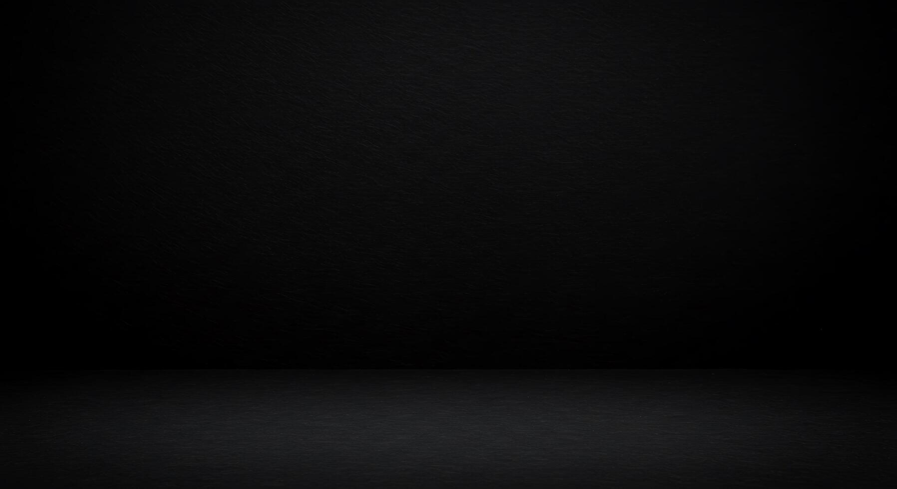 Black background with a dark wall and a light photo