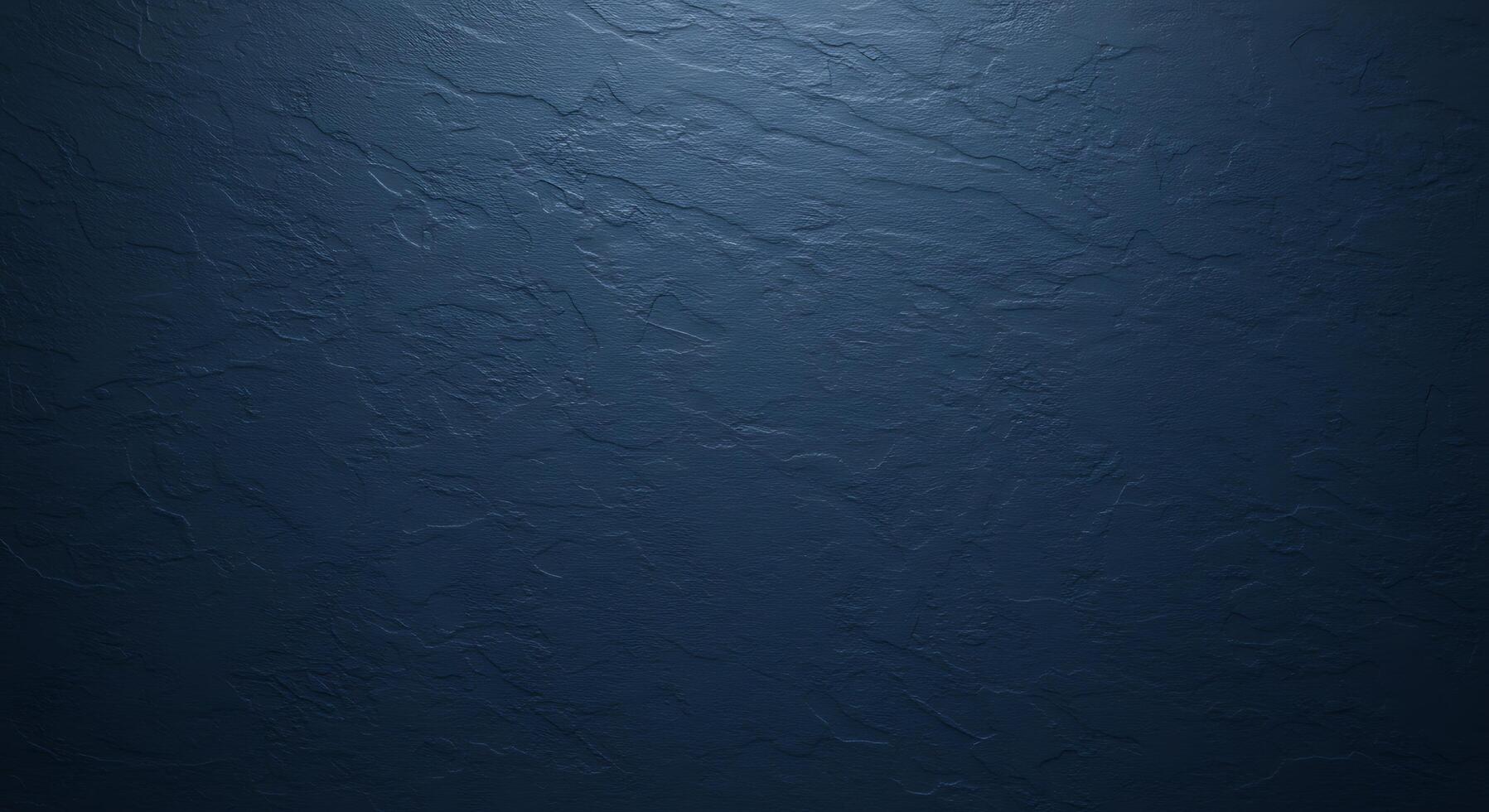 A dark blue wall with a rough texture photo