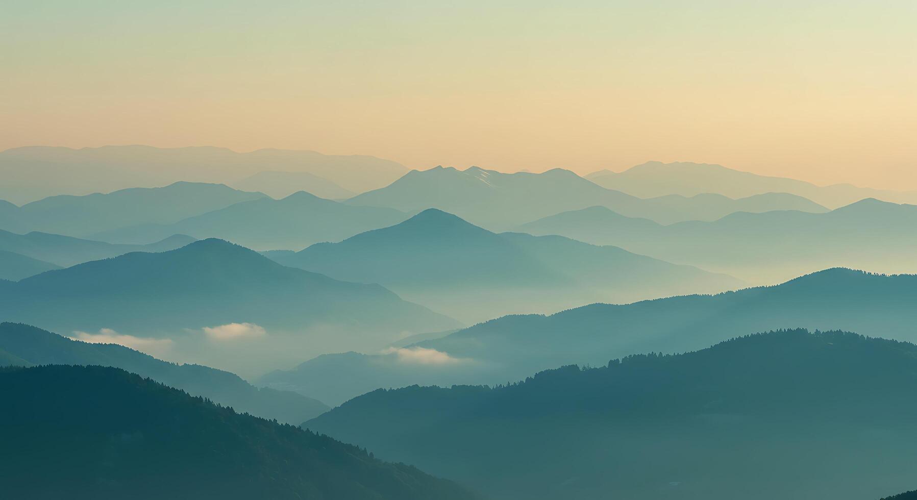 A view of mountains in the morning with fog photo