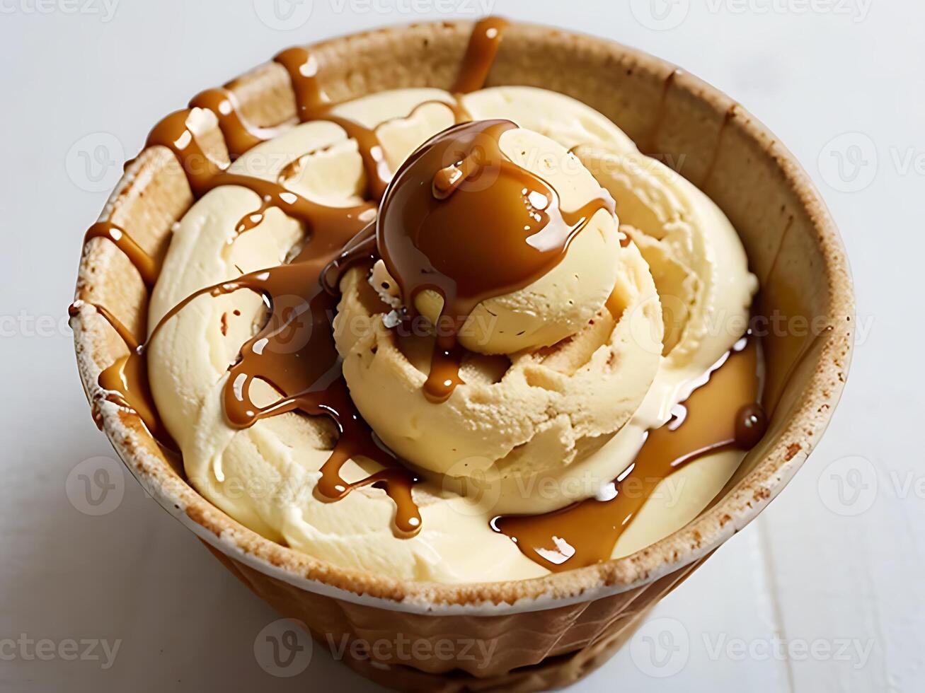 Melting Caramel Ice Cream Scoop on Waffle Cone Isolated on White photo