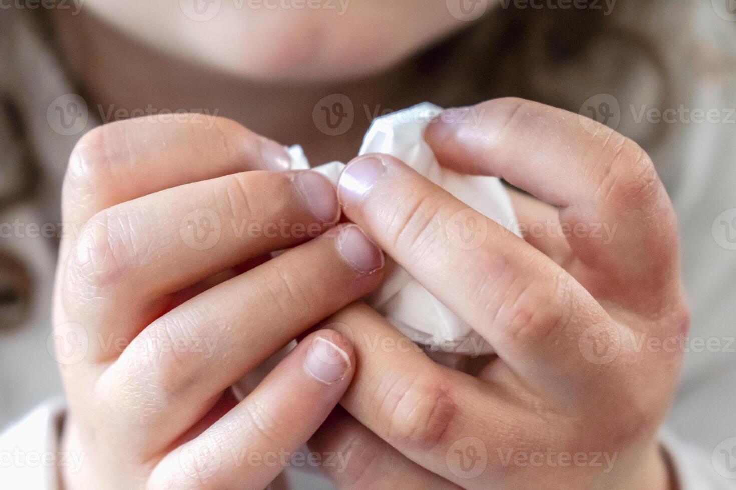 Child with a handkerchief in his hands, authentic activity, allergy, illness, cold, rhinitis, medical photo