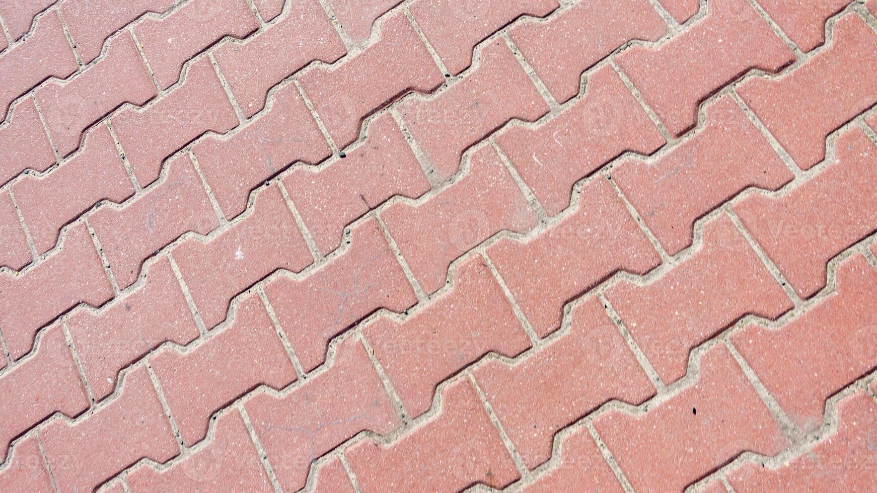 red paving stones with a visible texture. background or textura photo