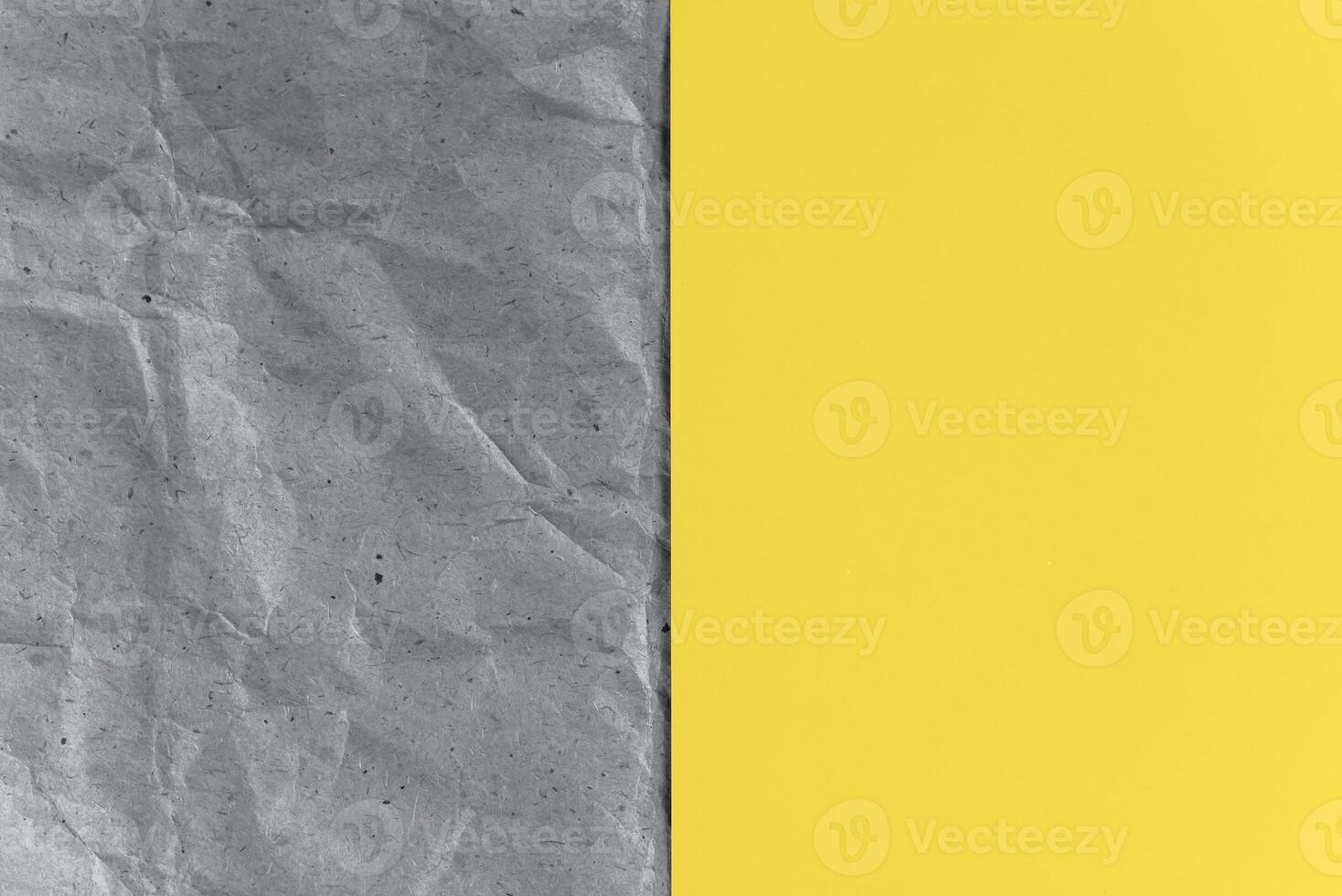 Gray craft paper and yellow sheet. Texture background, top view. Trending colors 2021. photo