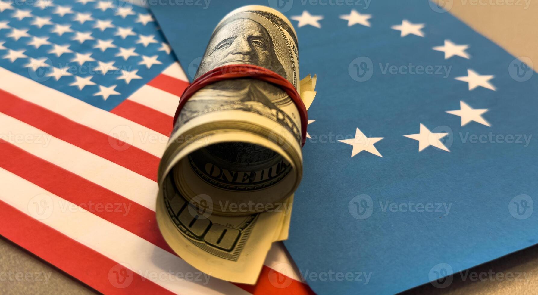 American money. 100 dollars on the American flag and flag of the European Union. World economic crisis. Currency exchange. Fed photo