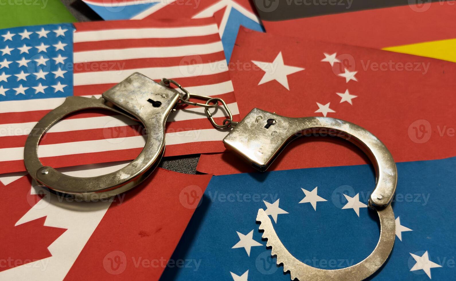 flags of different countries and handcuffs photo