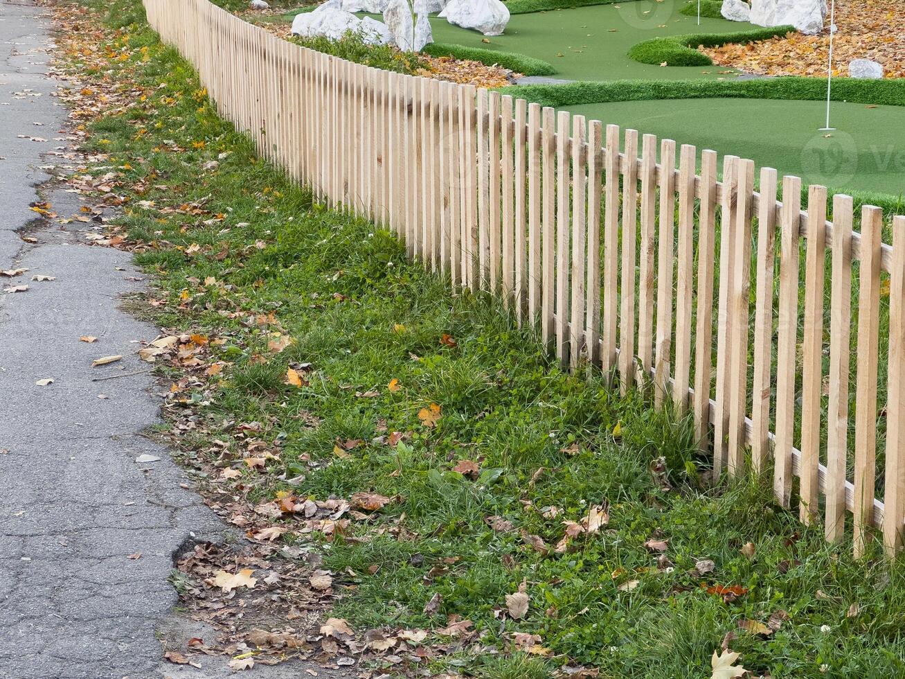 old wooden garden fence in autumn photo