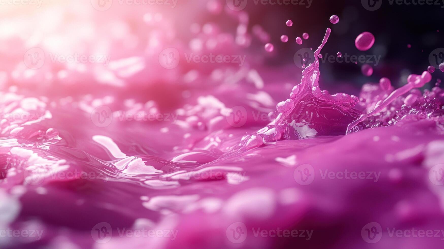 Vibrant pink liquid splashes create mesmerizing patterns in soft lighting photo