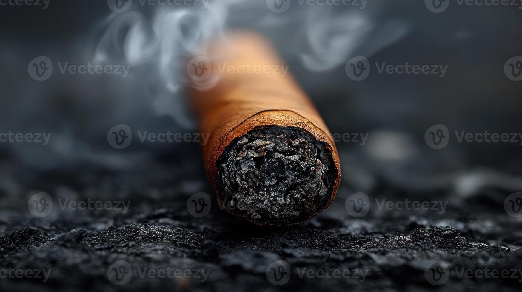 Captivating smoke swirls from an embering cigar amidst dark textures at dusk photo