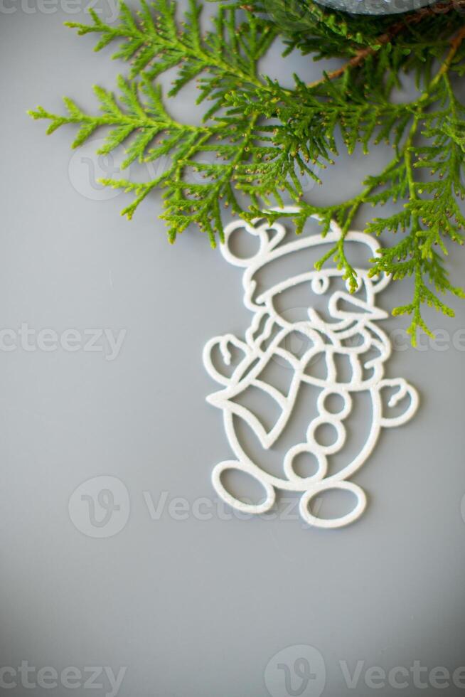 Christmas card. Christmas composition with a white ball and a snowman in the snow photo