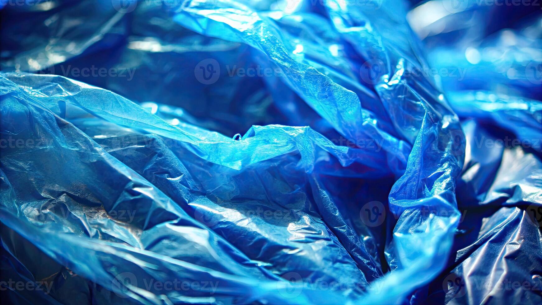 A crumpled sheet of vibrant blue plastic material. photo