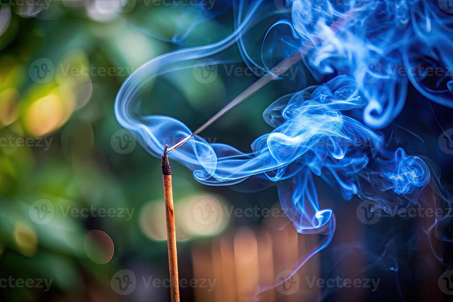 Delicate incense smoke curls softly in the air. photo