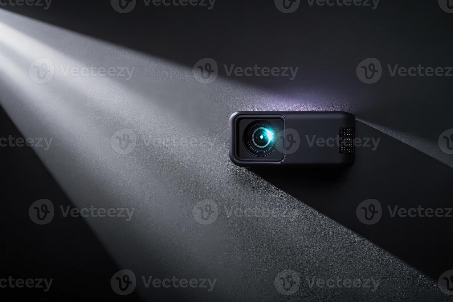 A small projector casting a beam of light in a dark room. photo