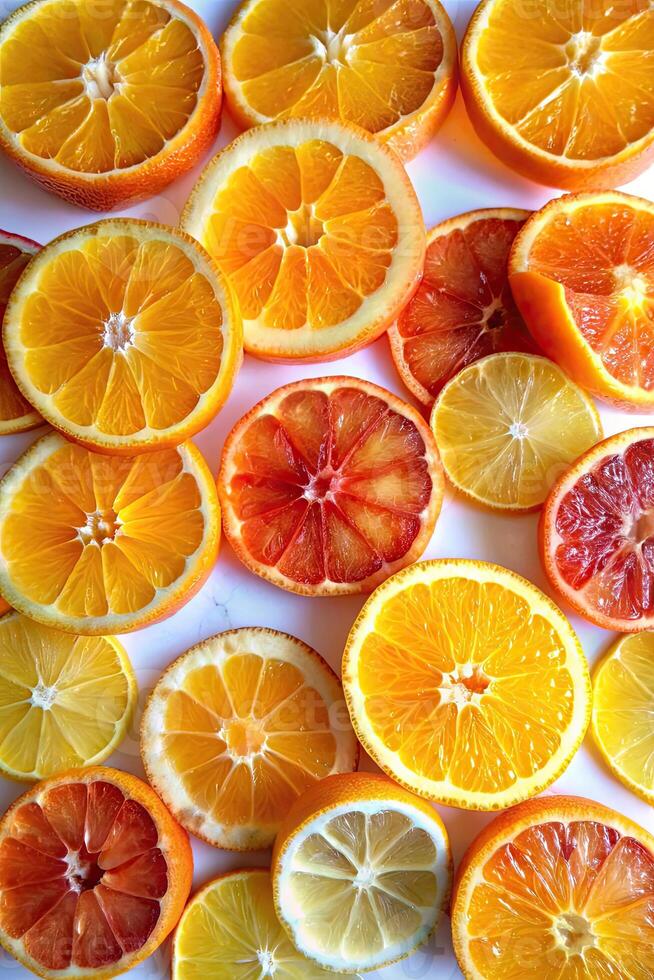 Sliced citrus fruits arranged in a vibrant, colorful pattern. photo
