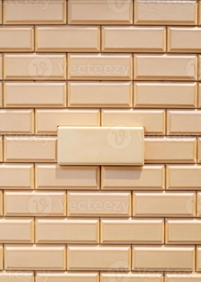 Glossy beige subway tiles create a sleek modern look. photo