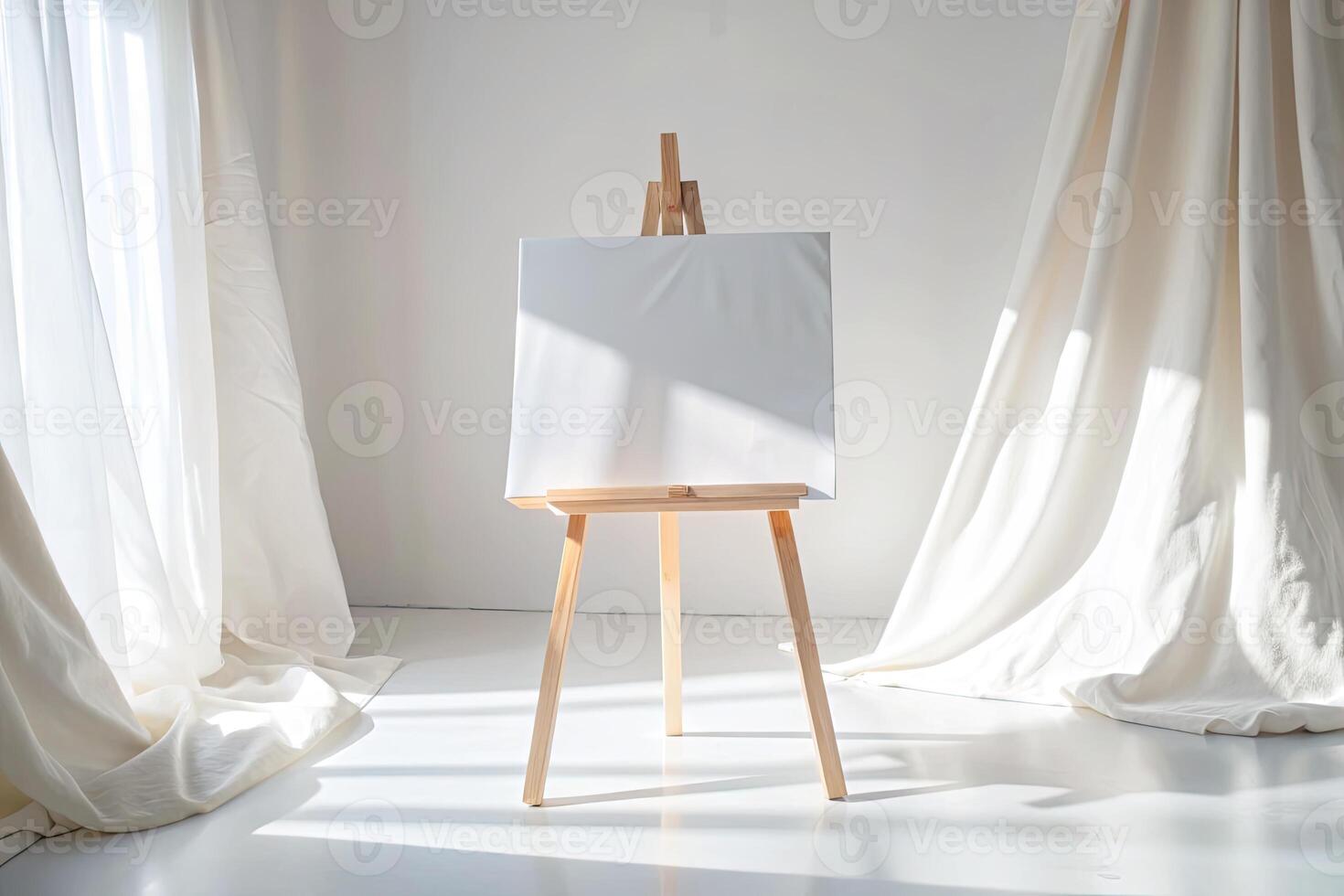 Blank canvas on an easel in a sunlit room with draped curtains. photo